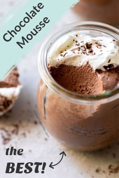 chocolate mousse in a glass jar with whipped cream on top