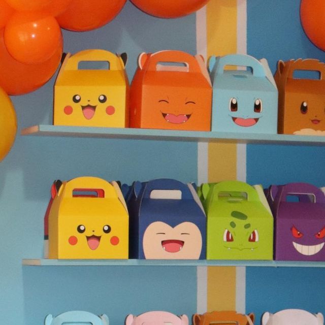 there are many boxes on the shelves with faces painted on them and balloons in the background