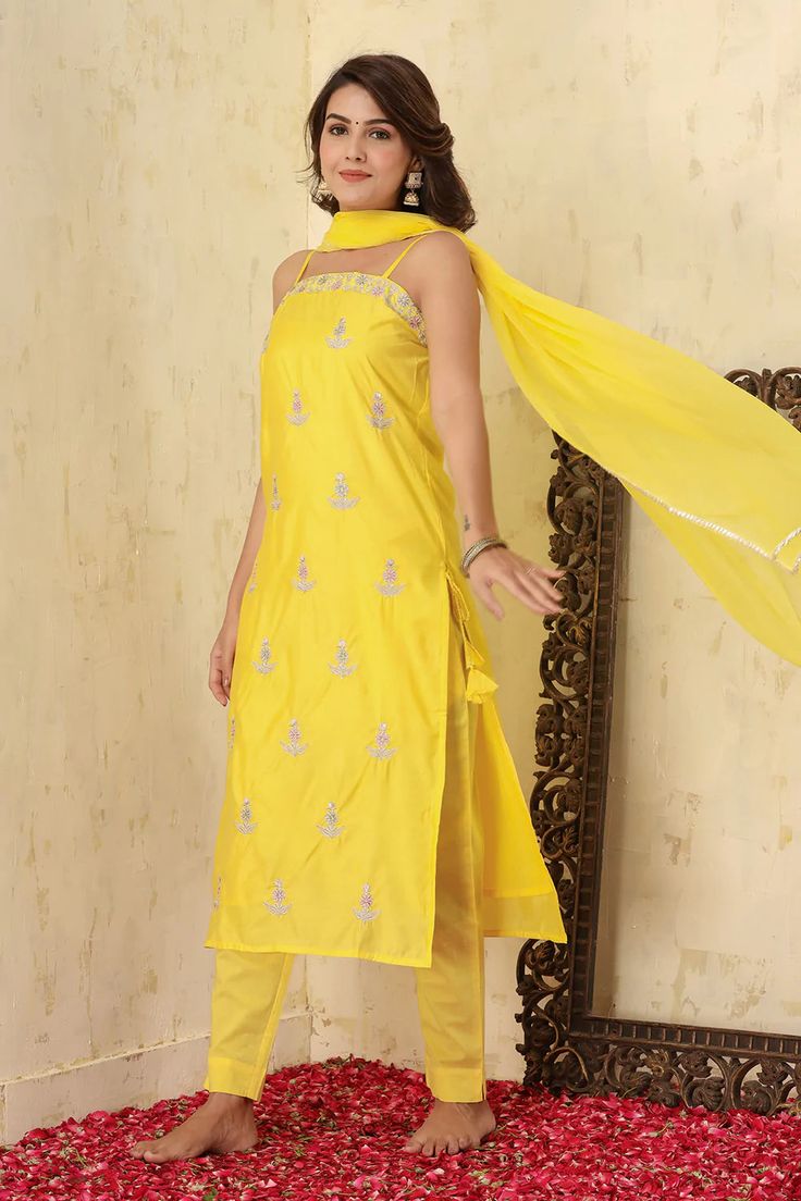 This is a 3-piece set. The set consists of zari embroidered & motif all over on kurta with side tassels has square neck, shoulder strap sleeves, calf length teamed with trouser pants and a dupatta. 3-piece set Color-Yellow Fabric-Silk Kurta Length-Calf Length Sleeves-Sleeveless Neck-Sqare Neck Work-Embroidery done with zari detailing & motif work all over with side Tassels. Washing Care-Wash Separately Sleeveless Suit, Silk Kurta, Yellow Fabric, Fabric Silk, Suit Set, Trouser Pants, Indian Wear, Online Retail, Square Neck