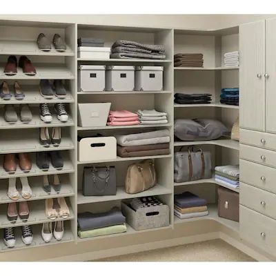 an organized closet with shoes, bags and other items