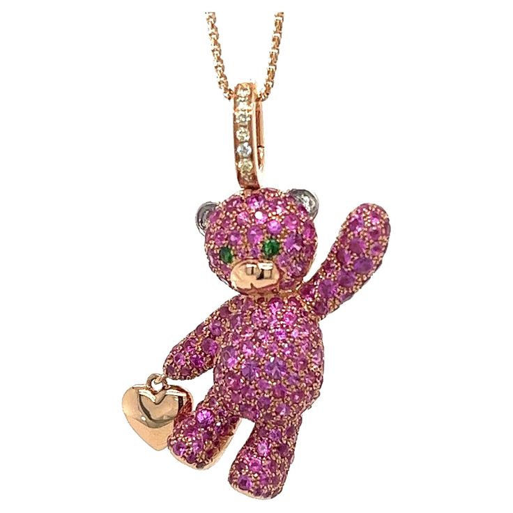 18K Gold Bear Necklace with Fancy Diamonds & Pink Sapphires 7 Fancy Diamonds 0.06 CT 2 Green Garnet 0.04 CT 202 Pink Sapphires 3.10 CT 18K Rose Gold 8.98 GM Elevate your jewelry collection with this stunning 18K gold necklace adorned with delicate pink sapphires. Add a touch of luxury and elegance to any outfit with this beautiful, high-quality necklace. The perfect gift for a loved one or a special treat for yourself, this necklace is sure to impress. With its unique design and exquisite craftsmanship, this necklace is a true work of art. Whether you're dressing up for a special occasion or simply want to add some sparkle to your everyday look, this necklace is the perfect choice. Luxury Cubic Zirconia Necklaces With Charms, Luxury Cubic Zirconia Necklace With Charms, Luxury Rose Gold Pink Sapphire Jewelry, Pink Sapphire Multi-stone Jewelry For Gifts, Multi-stone Pink Sapphire Jewelry For Gifts, Luxury Collectible Cubic Zirconia Jewelry, Rose Gold Multi-stone Jewelry With Pink Sapphire, Rose Gold Multi-stone Pink Sapphire Jewelry, Luxury Pink Gold Diamond Necklace