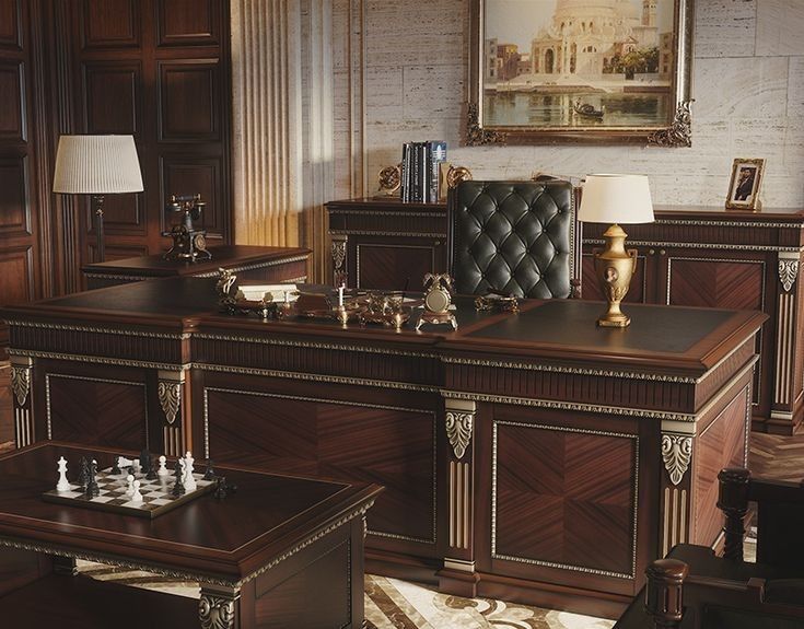 a large wooden desk sitting in the middle of a living room next to a chair