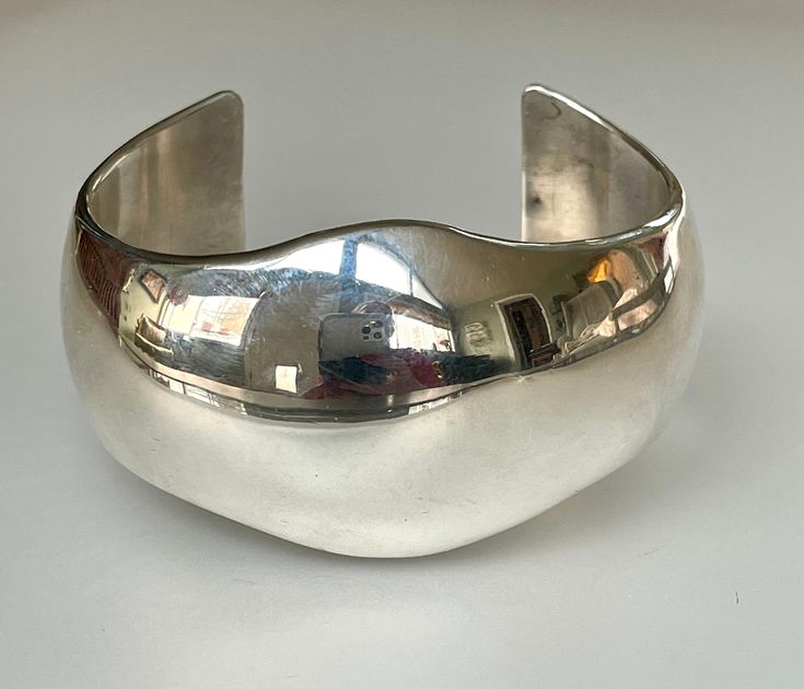 "This sleek yet substantial modernist cuff bracelet was made in the 1960s late modernist era, when this chunky, bold style was all the rage. It turns out that this has become a classic look, as this bracelet can be worn with jeans and business suit alike! It is solid Sterling silver, and is marked \"JRY\" by the designer. This bracelet came from a large modernist estate collection, however I cannot seem to identify the actual designer. I have seen the same maker's mark on other modernist pieces Modern Silver Jewelry, Vintage Silver Jewelry, Wide Cuff Bracelets, Modernist Jewelry, Bold Style, Stacked Jewelry, Wide Cuff, Business Suit, Maker's Mark