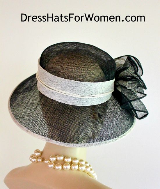 Ladies Black And White Wide Brim Sinamay Straw Designer Fashion Hat. This Dress Hat Is Suited For Weddings, Formals, Bridal, Mother Of The Bride, The Kentucky Derby And Horse Races.

Measurements: Crown Measures 22.5".  This lovely headpiece is suited for Spring, Summer or Early Fall.

All Sales Are Final. Black Summer Hat For Wedding, Black Summer Wedding Hat, Summer Black Wedding Hat, Summer Wedding Black Hat, Black Mini Hats For Summer Weddings, Fitted Sun Hat With Flat Brim, Fitted Black Hat For Wedding, Fitted Black Sinamay Hat, Fitted Wide Brim Boater Hat