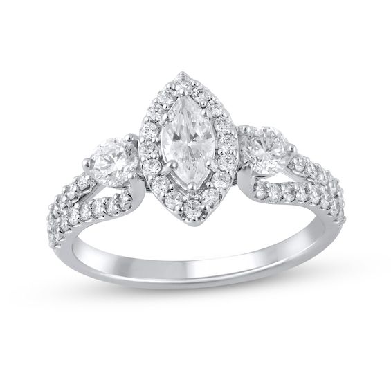 Start your love story with the exquisite sparkle of this marquise and round diamond three-stone engagement ring. Created in 14K white gold A diamond halo surrounds the 3/8 ct. marquise-cut diamond. Shimmering 1/5 ct. round diamonds flank the center. Diamonds line the looped ribbons of the split shank. This engagement ring dazzles with 1-3/8 cts. t.w. of diamonds. Diamond White Marquise Three Stone Diamond Ring, Fine Jewelry Marquise Three-stone Ring, Fine Jewelry Marquise Three-stone Piece, Fine Jewelry Marquise Three-stone, Fine Jewelry Marquise Three Stone, White Marquise Cut Three Stone Jewelry, Fine Jewelry With Marquise Three-stone Design, Silver Marquise Three-stone Diamond Ring, Silver Three Stone Marquise Diamond Ring