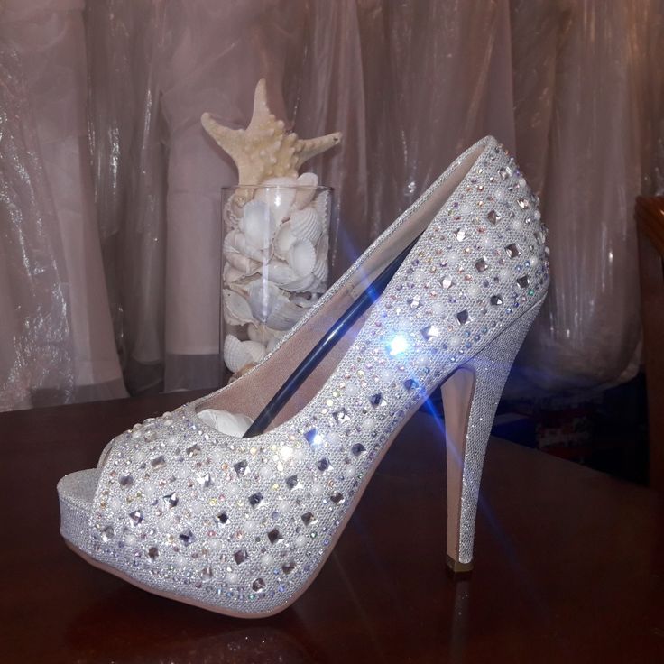 Material: Leather Upper/Rhinestone Condition: New In Box Size: 8.5 Occasions: Formal, Wedding, Party Glamorous Wedding Shoes With Rhinestones And Round Toe, Crystal Wedding Shoes With Rhinestones For Prom, Crystal Wedding Shoes With Rhinestones, Glamorous Crystal Wedding Shoes For Prom, Silver Rhinestone Wedding Shoes For Prom, Crystal Embellished Heels For Prom, Glamorous Wedding Shoes With Rhinestones, Formal Wedding Party, Rhinestone High Heels