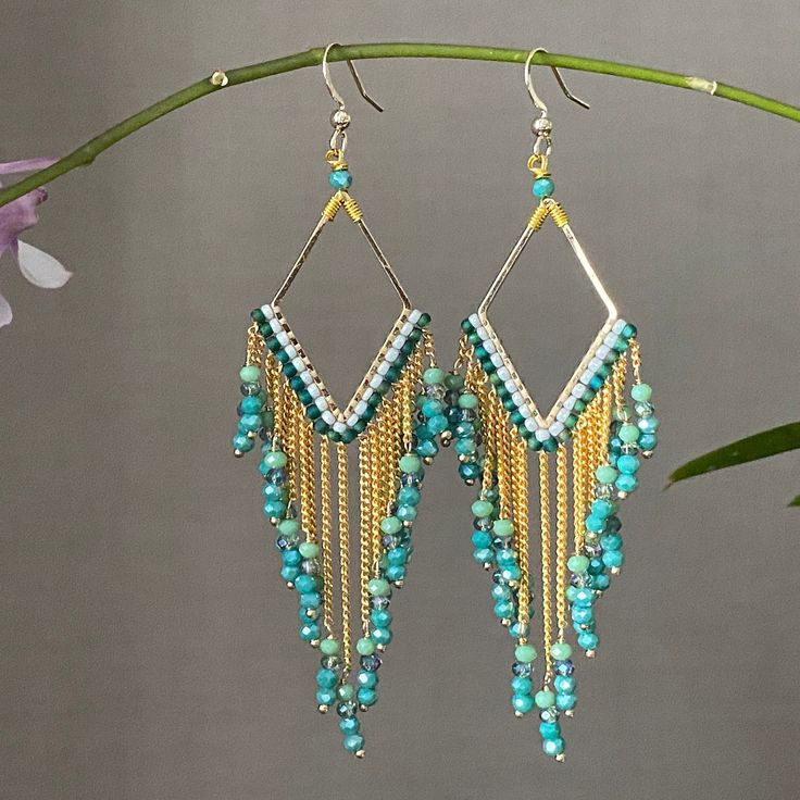 Long Turquoise dangle beads earrings purple mint and lavender. Costume Jewelry With Faceted Dangle Beads, Turquoise Beaded Dangle Jewelry, Turquoise Dangling Beads Costume Jewelry, Bohemian Gold Earrings With Faceted Beads, Costume Jewelry Beaded Dangle Earrings, Turquoise Costume Jewelry With Dangling Beads, Elegant Dangle Jewelry With Colorful Beads, Bohemian Crystal Earrings With Faceted Beads, Turquoise Teardrop Earrings With Faceted Beads