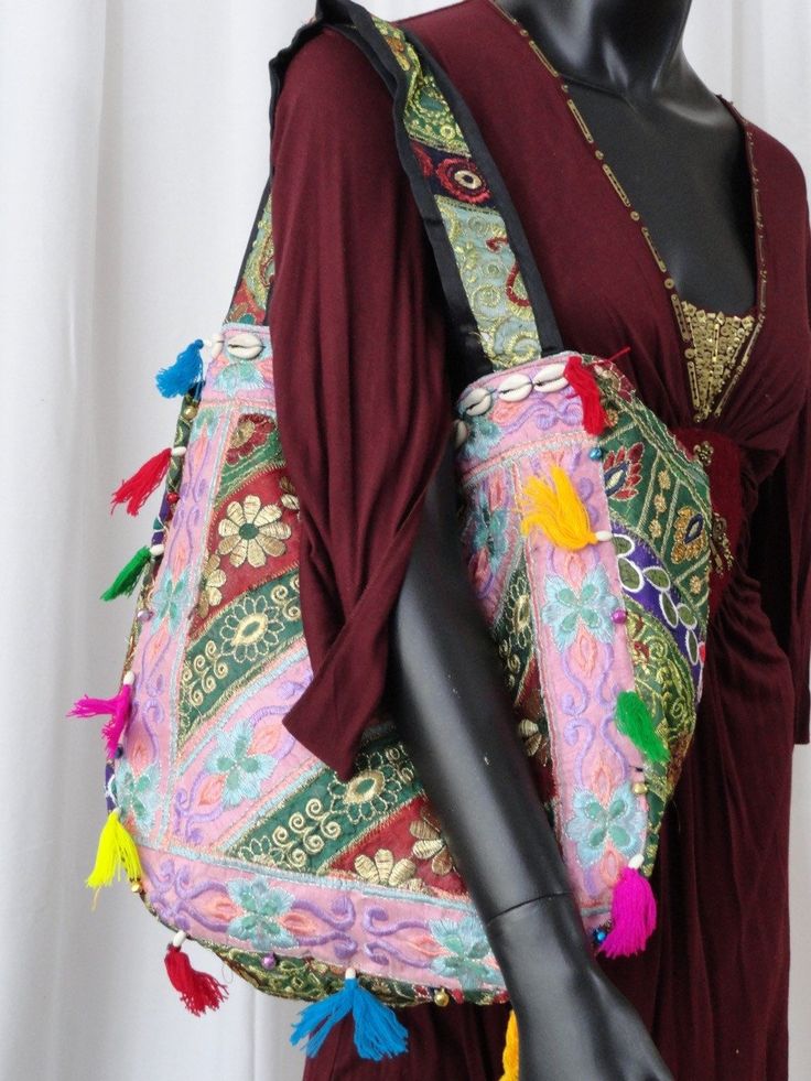 Patchwork, embroidery and sequins women's tote bag. A colourful ethnic shoulder bag from India for women. Unique, classy day or evening hand bag. Take patches of colourful cloth. Add interesting embroidery of sequins and stones and beads. Add some more colourful stitches with contrasting colour thread. Mix and match the patches and hand stitch them with a colourful beading. Add handles. Voila! You have a tote bag that is so unique that there just cannot be another one such, anywhere in the unive Festive Rectangular Shoulder Bag With Mirror Work, Festive Multicolor Rectangular Shoulder Bag, Bollywood Style Multicolor Festive Bags, Bohemian Shoulder Bag With Zari Work For Festivals, Festival Multicolor Embroidered Hobo Bag, Bollywood Embroidered Shoulder Bag For Festivals, Embroidered Bollywood Festive Shoulder Bag, Bollywood Bags With Mirror Work For Festivals, Bollywood Style Embroidered Shoulder Bag For Festivals