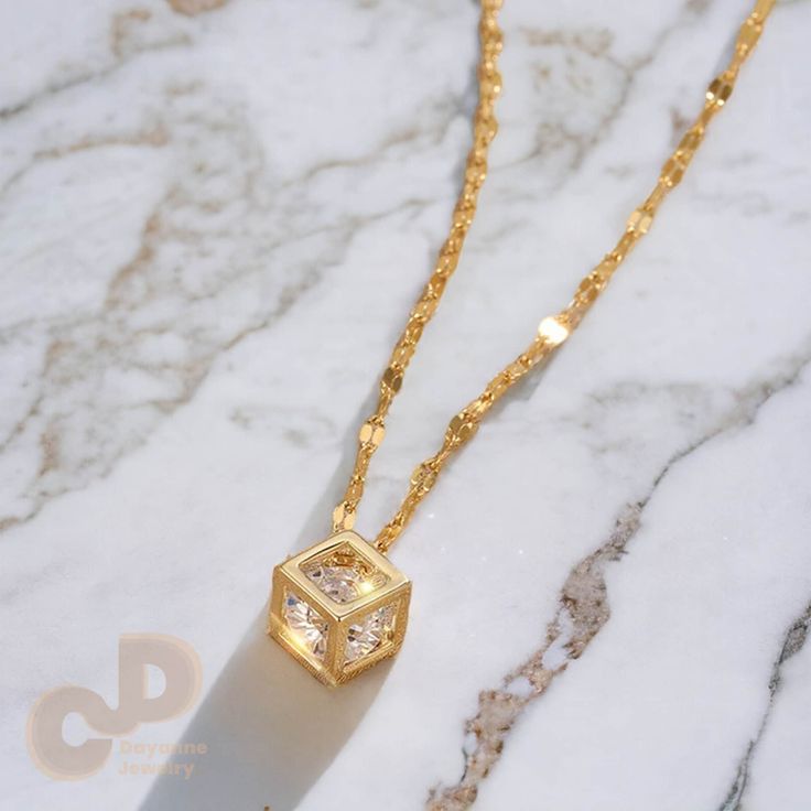 This is my my new minimalist necklace that features a gold or rose gold cube with a cubic zirconia in it. This is a perfect CZ necklace for those looking for something elegant and beautiful without being too extravagant and loud but instead has a perfect balance. This Necklace is crafted from 14K Gold, ensuring hypoallergenic properties.  Please don't hesitate to contact me with any questions before or after placing an Order! :) ⭐ ✩ SHIPPING ✩ All the orders will be shipped to the shipping addre Modern Cubic Zirconia Necklace As Gift, Modern Cubic Zirconia Necklace For Gifts, Cubic Zirconia Box Chain Necklace As Gift, Cubic Zirconia Box Chain Necklace For Gift, Gift Necklace With Cubic Zirconia And Box Chain, Gold Cube, Cube Pendant, Cube Necklace, Cz Necklace