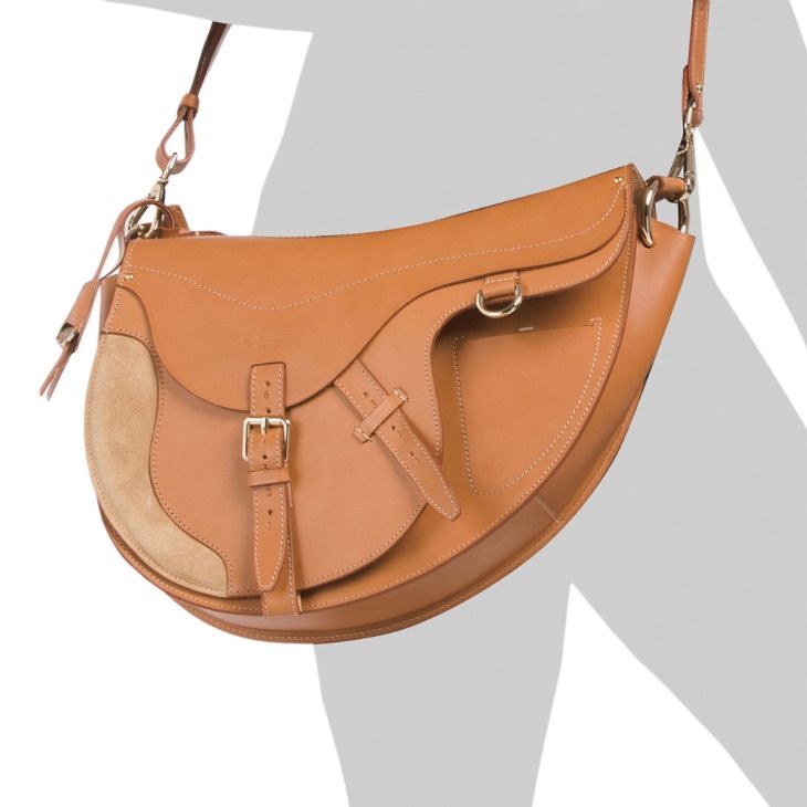 Boldrini Made In Italy Leather Asymmetrical Saddle Bag Product Details Contrast Details, Buckle Accents, Suede Details, Detachable Adjustable Crossbody Strap, Shoulder Strap, Asymmetrical Design 10.75in W X 9in H Magnetic Closure 1 Interior Zip Pocket, 1 Interior Card Slot, 1 Exterior Slip Pocket Leather Made In Italy Cognac Saddle Bag With Removable Pouch, Chic Saddle Bag For Daily Use, Cognac Saddle Bag With Leather Lining, Designer Saddle Bag For Travel, Designer Travel Saddle Bag, Modern Saddle Bag, Cognac Crossbody Saddle Bag With Leather Handles, Designer Saddle Bag For Everyday Use, Leather Handle Saddle Bag