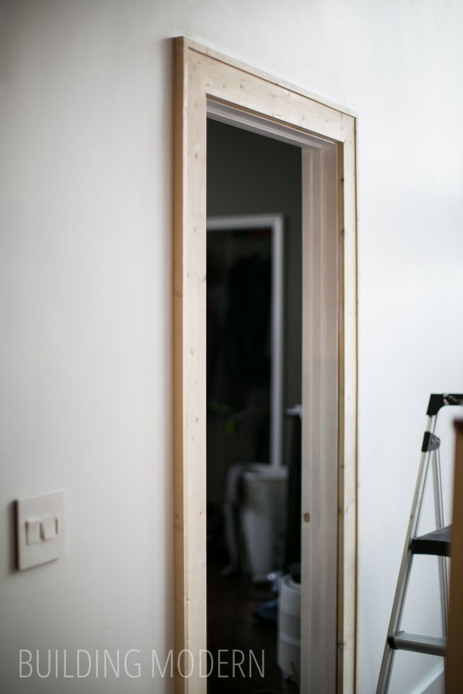 an empty room with a ladder leaning against the wall