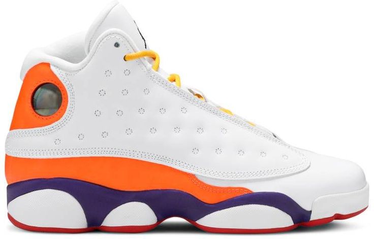 Jordan Brand’s habit of using unorthodox color schemes on grade school exclusives is illustrated by the Air Jordan 13 Retro GS ‘Playground.’ The retro mid-top features a white leather upper with mismatched detailing . highlighted by contrasting green and yellow accents on the left shoe and a combination of orange and purple on the right shoe. Common branding elements include a Jumpman on the tongue and a holographic ‘cat eye’ on the lateral heel. White Throwback High-top Sneakers For Streetwear, Jordan 1 Milan, Air Jordan 1 Obsidian, Jordan 1 Blue, Blue Chill, Jordan 1 Black, Retro 13, Air Jordan 13 Retro, Jordan 8