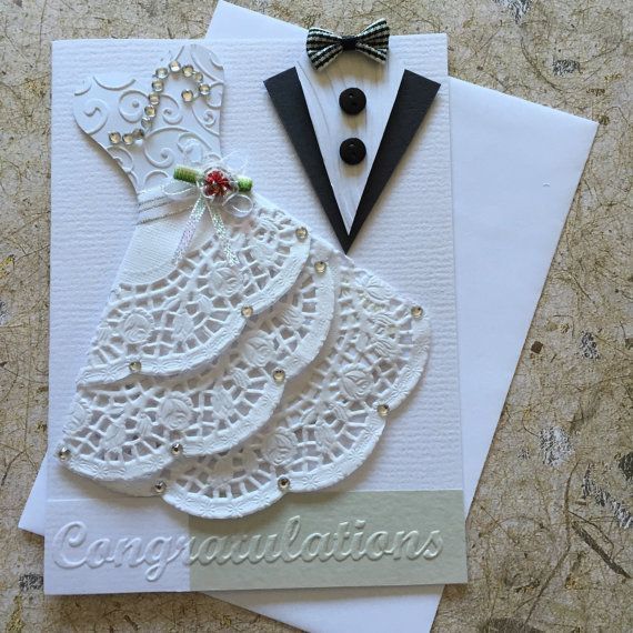 a close up of a greeting card with a suit and tie on the top one