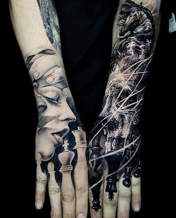 two hands that have tattoos on them and one has a woman's face in the middle