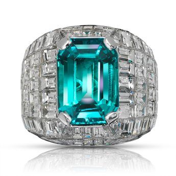 MUZO -30 CARAT MEN’S EMERALD AND DIAMOND CHANDELIER RING BY MIKE NEKTA Ring: Metal: 18K WHITE GOLD Style: MENS CHANDELIER DIAMOND AND EMERALD RING Diamonds: 22 Carats Emerald: 7.56 Carats Size: Can be adjusted to any size. Luxury Men's Emerald Ring With Vvs Clarity, Luxury Men's Emerald Ring With Center Stone, Luxury Men's Emerald Fine Jewelry Ring, Luxury Men's Fine Jewelry Emerald Ring, Luxury Exquisite Emerald Ring With Center Stone, Exquisite Luxury Emerald Ring With Center Stone, Luxury Art Deco Diamond Men's Ring, Luxury Men's Emerald Anniversary Ring, Luxury Men's White Gold Emerald Ring