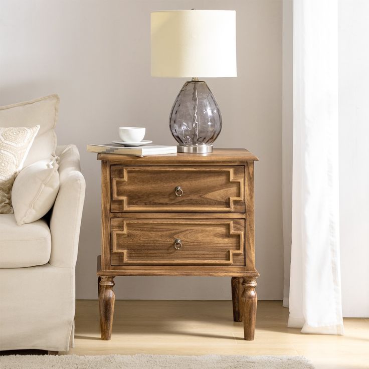 a living room scene with focus on the end table and coffee cup sitting on it