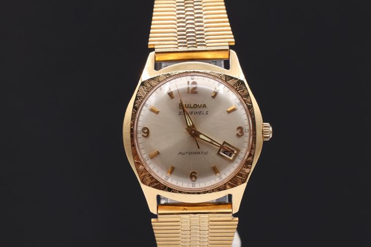 This is rare, authentic, vintage Bulova M9 automatic watch made 1969. It works and keeps accurate time. The watch was fully serviced and oiled. The watch requires no battery, it is operated on wind up mechanism!. it is ready to worn. Condition: very good Case: heave gold electroplated; lug to lug 39mm; width without crown 34mm Case back; rolled gold; ref # G366245 Crystal: polymer glass; free of any scratches or damages Dial: original Bulova; silver tone; date window at 4 o'clock Strap: stainless steel; gold plated; width is 18mm Movement: U.S.A. - Bulova; 23 jewels; mechanical; automatic; Cal # 10CPACD; fully services MM Size Reference: Eisenhower silver dollar = 38mm Kennedy Half dollar = 30mm Washington Quarter = 24mm 1. Please check the photos/size carefully. We will not refund due to Retro Watch Accessories With Date Indicator, Vintage Chronometer Watch For Anniversary, Vintage Chronometer Watches For Anniversary, Retro Formal Watch With Date Indicator, Retro Automatic Watches For Formal Occasions, Retro Automatic Watch Accessories For Anniversary, Vintage Watch Accessories With Date Indicator For Formal Occasions, Vintage Automatic Watch For Formal Occasions, Vintage Automatic Watches For Formal Occasions