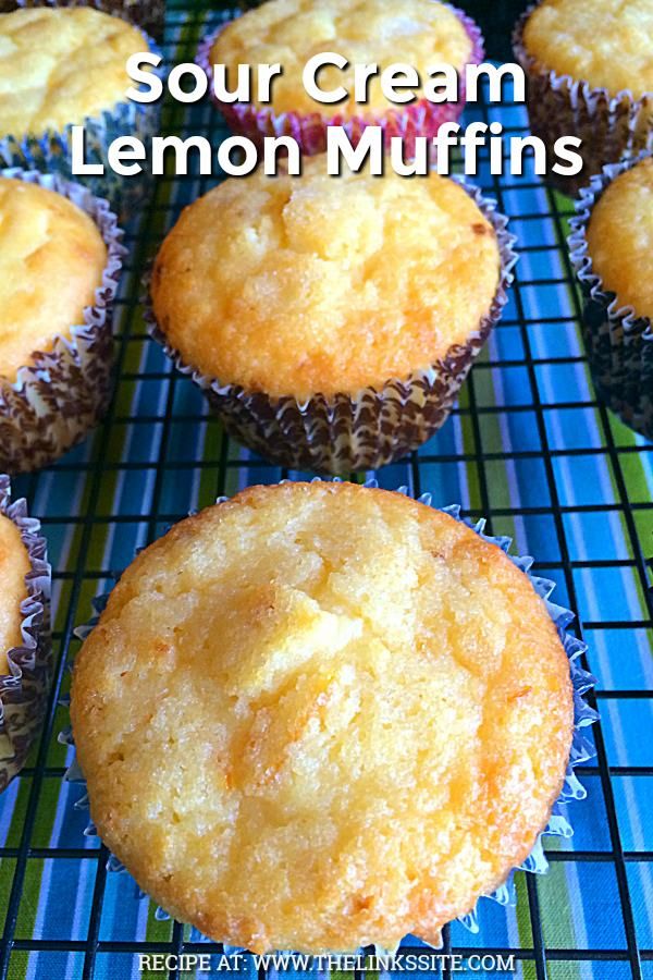 lemon muffins on a cooling rack with the words sour cream lemon muffins