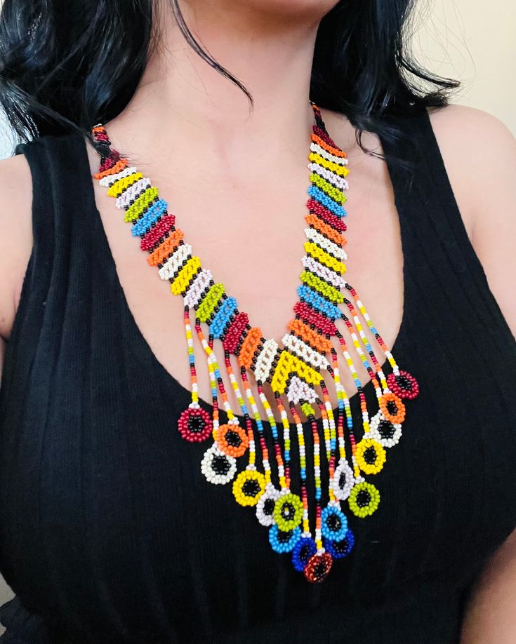 A vibrant and colorful necklace to enhance your style.🏵 Unique Multicolor Beaded Necklaces For Beach, Unique Multicolor Necklaces For The Beach, Colorful Adjustable Beaded Necklaces With Polished Beads, Colorful Adjustable Beaded Necklace With Polished Beads, Multicolor Beaded Chain Jewelry For Summer, Multicolor Beaded Jewelry For Summer, Round Beaded Necklaces For Festivals, Summer Large Bead Multicolor Necklace, Summer Multicolor Beaded Necklace With Large Beads