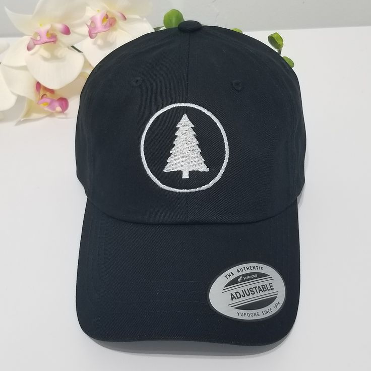 This hat is made in the USA, so wear it proud! It's unstructured with a curved visor and adjustable strap, and an American flag sewn on the back. PINE TREE Hat / Wildlife Cap / Hiking Baseball Cap / Adventure Custom Embroidery / Best Friend Gift / Camping Embroidered Hat / Forest Woods * 100% washed cotton chino twill * Unstructured, 6-panel, low-profile * Adjustable strap with hide-away buckle - US FREE SHIPPING! - High Quality - Closure: Self-fabric adjustable strap slide closure with buckle. Outdoor Embroidered Trucker Baseball Cap, Embroidered Trucker Hat For Outdoor, Embroidered Snapback Baseball Cap For Outdoor, Embroidered Outdoor Baseball Cap, Embroidered Cotton Fitted Hat With Curved Bill, Custom Embroidered Dad Hat, Embroidered Adjustable Baseball Cap For Outdoor, Snapback Cap With Embroidered Logo For Outdoor Activities, Adjustable Fitted Baseball Cap With Embroidered Patch