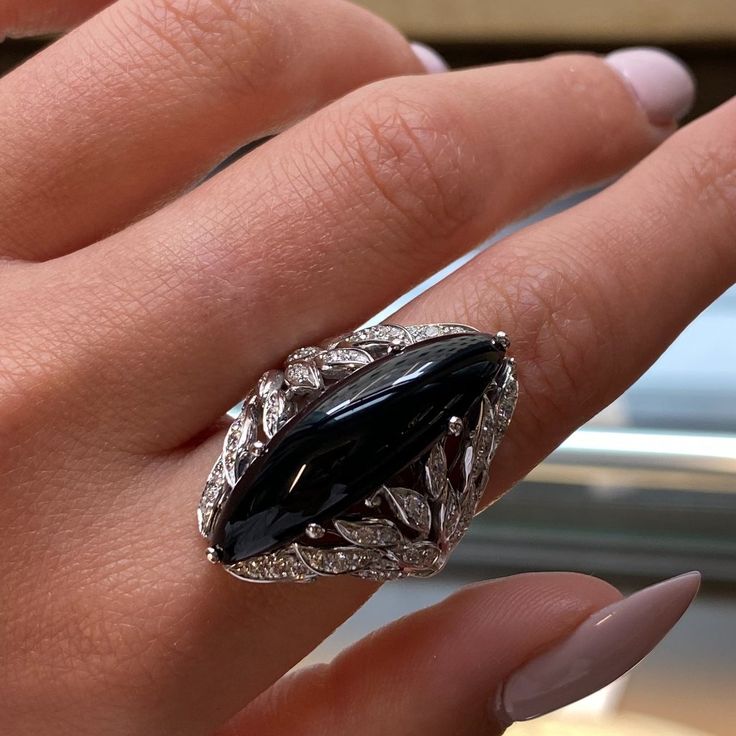 This Beautiful Cocktail Ring Features A Large Natural Marquise Shape Black Onyx In 18k White Gold. Set With 0.79cttw Of Brilliant Cut Diamonds. Diamond Color G And Vvs Clarity. Onyx Weights 2.40 Grams. Ring Size 6.5. Top Measurements: 32.00mm. Comes With Original Box And A Certificate. Id: 048385 Onyx And Gold Ring, Luxury Evening Rings With Gemstone, Elegant Evening Diamond Ring With Gemstone, Luxury Onyx Jewelry For Weddings, Luxury Onyx Diamond Ring For Formal Occasions, Classic Black Spinel Diamond Ring For Formal Occasions, Luxury Onyx Rings For Formal Occasions, Elegant Black Diamond Ring With Vvs Clarity, Luxury Black Spinel Jewelry For Formal Occasions