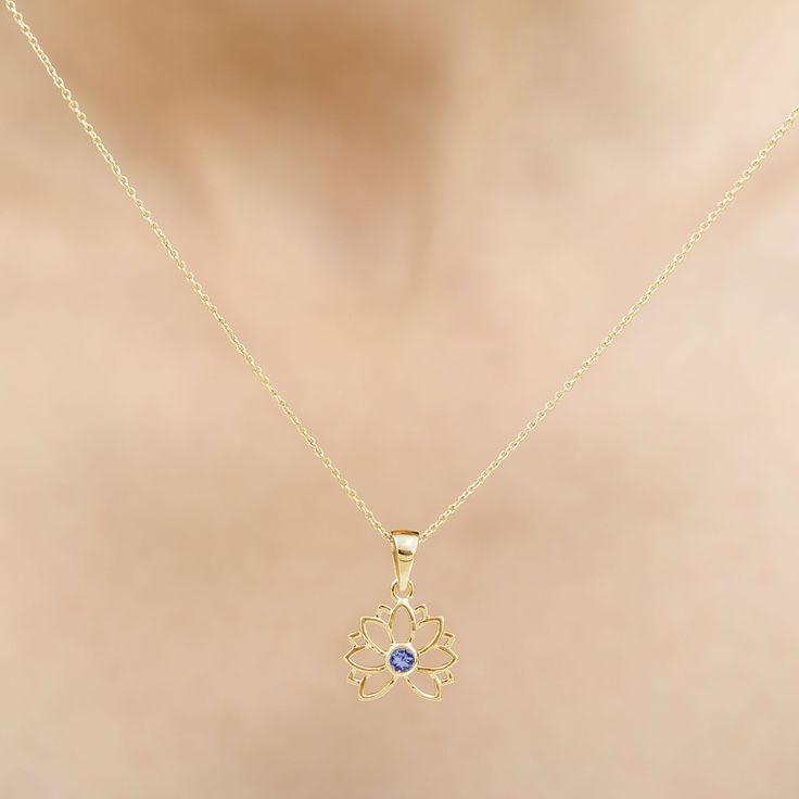 Product Details Lotus Pendant has stunning Round Solitaire Tanzanite stone encased in bezel setting to enhance the beauty of Floral Charm Necklace. Solid Gold is used to craft this enchanting piece. Stack it or wear alone for statement look. Product Information SKU SHP-PENDANT092022355 Length 18.5 mm Width 15 mm Weight 3.12 gm (Approximate) TANZANITE INFORMATION No.of Stones 1 Pieces Total Weight 0.13 Carat (Approximate) Dimension(approx) Round-3X3 mm-1 Pcs Color Blue Cut Brilliant Shape Round S Lotus Flower Pendant, Tanzanite Necklace, Lotus Pendant, Tanzanite Stone, Round Solitaire, Signature Jewelry, Timeless Jewelry, Flower Pendant, Conflict Free Diamonds