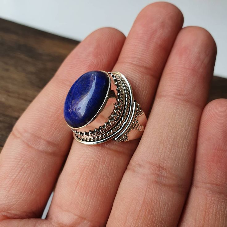 Natural Lapis Lazuli ring, Real Sterling Silver ring, cocktail ring, alternative engagement ring, avant garde, birthstone ring, Lapis Lazuli jewellery Description: Be assured that the product you order is MADE JUST FOR YOU and is not a mass produced item. The gemstone is a OVAL shaped LAPIS LAZULI GEMSTONE SIZE- 18*13 mm. You have an option to choose a gem for yourself from a set of the stones. Please ask. The rest of the ring is made from 925 STERLING SILVER i.e 92.5% pure silver. And it DOESN' Handmade Adjustable Sapphire Ring For Anniversary, Bohemian Oval Crystal Ring Nickel Free, Handmade Adjustable Unique Sapphire Ring, Handmade Unique Adjustable Sapphire Ring, Handmade Adjustable Sapphire Open Ring, Handmade Spiritual Round Sapphire Ring, Handmade Adjustable Oval Ring, Handmade Adjustable Open Sapphire Ring, Bohemian Sapphire Ring As Gift