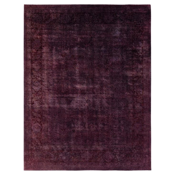 a purple rug with an intricate design on the top and bottom, it is made out of