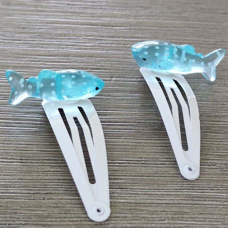 This is a set of aqua blue whale shark hair clips. The hair clips are white. They are 50mm long. You will receive two clips. Spacecore Accessories, White Hair Clip, Shark Hair, Pola Kotak, Whale Shark, Funky Jewelry, Pretty Jewellery, White Hair, Sharks