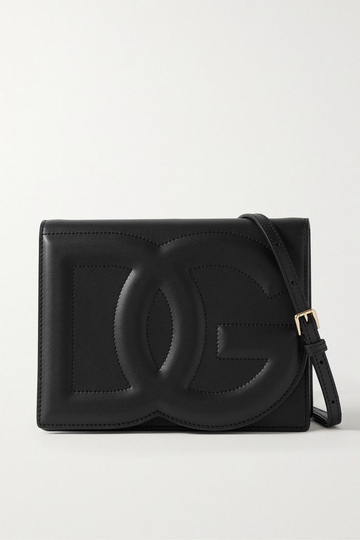 Dolce & Gabbana's bag has been made in Italy from sleek black leather and has a slim, structured silhouette with the label's embossed monogram at the front. It comes with a detachable shoulder strap, so you can wear it cross-body or as a clutch on nights out. The interior fits your phone, cardholder and lipstick for touch-ups. Black Accessories, Essential Items, Bag Light, Black Shoulder Bag, Black Bag, Leather Pouch, Pink Bag, Leather Shoulder Bag, Cross Body