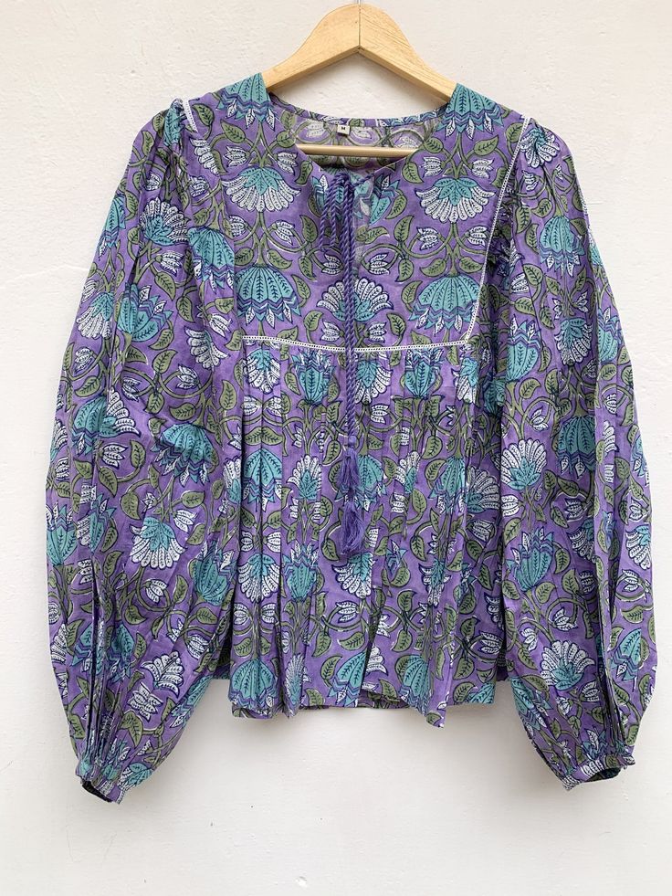 "ITEM DESCRIPTION cotton purple & turquoise lotus hand block print women's blouse / boho tunics tops / hippie blouse Features : Long sleeve, V neck, Blouse Material : Cotton Cambric, Hand Block Printed Fabric: 100% cotton soft light weight ethnic print fabrics Sleeve Length = 22 inch For more sizes & their measurement, please refer our below chart to understand the sizes variations available with us For your size requirement, please mention your size in seller note at the time of buying. Hand Printed Long Sleeve Blouse For Spring, Long Sleeve Hand Printed Blouse For Spring, Spring Long Sleeve Hand Printed Blouse, Purple Long Sleeve Tops For Festival, Long Sleeve Blouse With Block Print And Relaxed Fit, Lavender Long Sleeve Bohemian Tops, Bohemian Hand Printed Cotton Blouse, Purple Cotton Bohemian Blouse, Long Sleeve Tops With Batik Print And Relaxed Fit