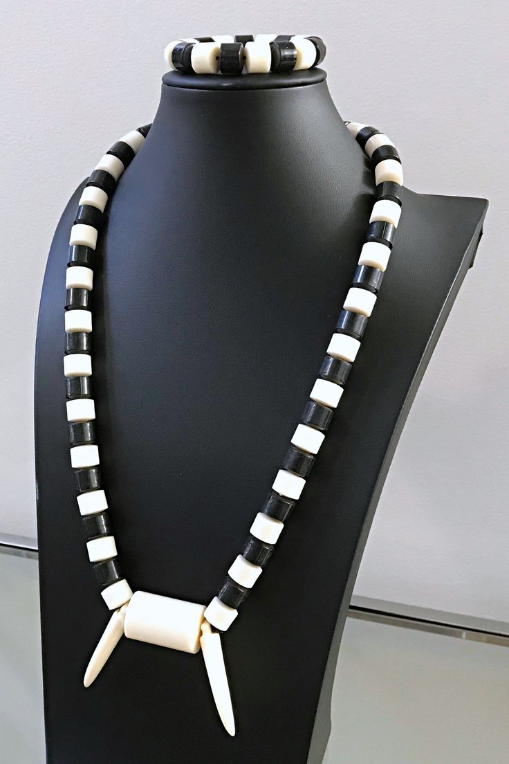 This is a traditional Central / West African beaded necklace for men and women. These jewelry pieces are unisex and are designed to be worn by adults Beads are made of plastic Length ( from neck to chest): 15 inches Come with one (1) elastic bracelet These beaded jewelry is an integral part of West African culture. Traditionally it is worn by Royalty, Chiefs, and those who are part of the Royal households among many kingdoms in West Africa. It is also worn by brides and grooms during their weddi White Wooden Beads Jewelry, White Wooden Beaded Jewelry, Traditional White Beaded Necklace With Polished Beads, White Large Beads Spiritual Jewelry, White Single Strand Spiritual Necklace, Spiritual Single Strand White Necklace, White Spiritual Long Beaded Necklaces, Traditional White Adjustable Beaded Necklace, Traditional White Beaded Necklaces With Adjustable Fit