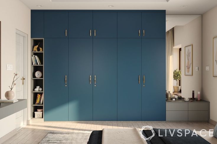 a bedroom with blue cabinets and white walls