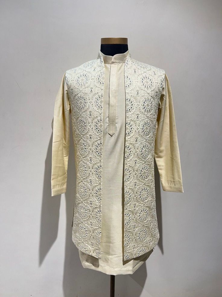 CUSTOM MADE Long Nehru Jacket for Man, Bandi for Men, Nehru Jacket for Diwali, Designer Modi Jacket, Nehru Jacket for Wedding for Men COLORS CUSTOMIZABLE Jacket Color-Off White Kurta Set -Matching Color(Same Color As The Jacket) INCLUDED IN SET SLEEVELESS JACKET KURTA PAJAMA Ceremonial Cream Nehru Jacket With Zari Work, Bollywood Style Cotton Silk Sherwani For Designer Wear, Chanderi Sherwani For Wedding And Festivals, Bollywood Style Cotton Silk Sherwani, Traditional Off White Raw Silk Bandhgala, Ceremonial Cream Bandhgala With Chikankari Embroidery, Cream Bandhgala With Chikankari Embroidery For Transitional Season, Traditional Raw Silk Bandhgala In Off White, Cream Bandhgala With Chikankari Embroidery In Raw Silk