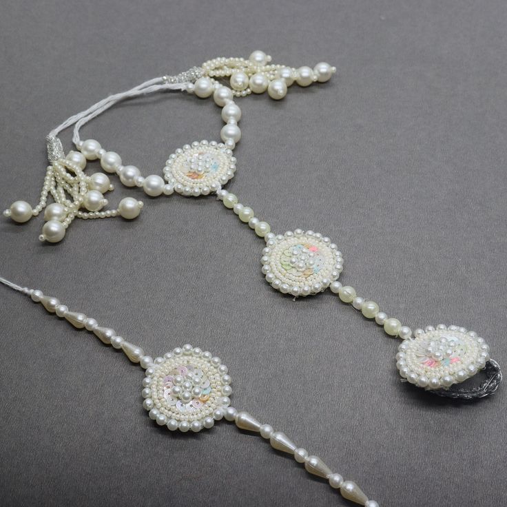 Beautiful White Pearl Sequin Beaded Hath Phool & Bracelet Bhaiya Bhabhi Rakhi Designed with the heart, this beautiful rakhi are made of premium material. Embroidered art work. Rakhi 2 Pcs Set. Rakhi For Bhaiya Bhabhi( tie loop, lumba) Rakhi For Brother, Rakhi Gifts, Rakhi, Rakhi, Brother Latest Rakhi, Designer Rakhi, Send Online Rakhi To Brother We welcome wholesale quires and all feedback. Beads Rakhi Designs, Adjustable Traditional Anklets For Party, White Anklets For Festivals Gift, Handmade Adjustable Anklets For Festive Season, White Anklets For Festivals And Gifts, Festive Handmade Adjustable Anklets, Beaded Jewelry For Navratri Wedding, Beaded Jewelry For Wedding And Navratri, Adjustable White Jewelry For Navratri