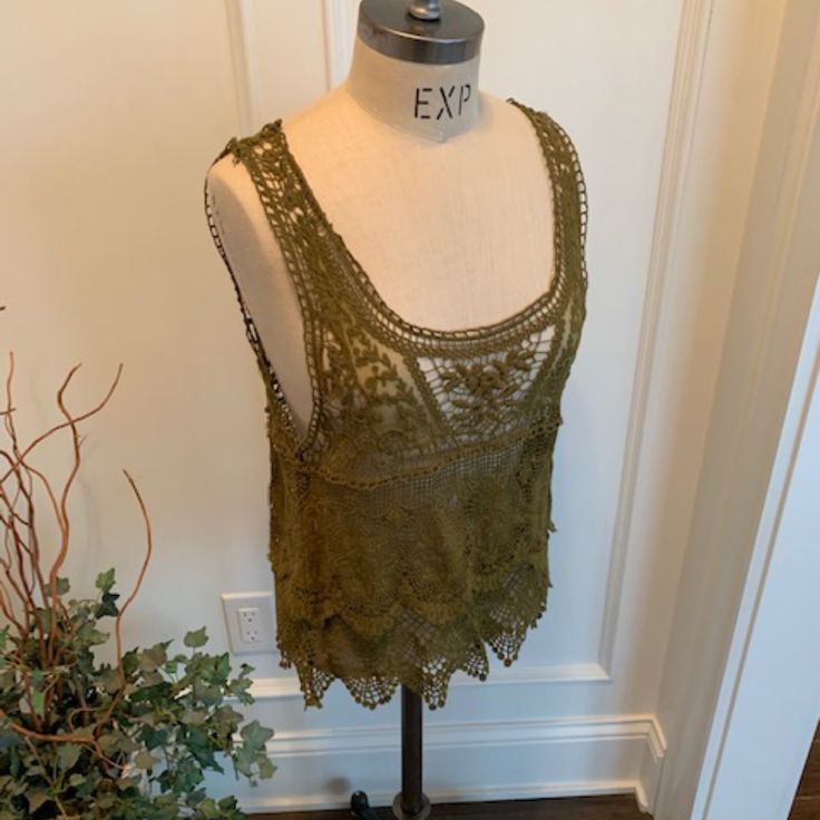 Forvever 21 Nwt Women's Olive Lace Camisole/Great Versatile Item For Your Wardrobe/Looks Fun Worn Over A Knit Tank Dress Or Just Over A Cami/Juniors Size L/Nwt/Mint Condition Forever 21 Spring Crochet Top, Spring Camisole Vest, Spring Crochet Top By Forever 21, Spring Crochet Top From Forever 21, Forever 21 Summer Cami Top, Forever 21 Cami Tops For Summer, Bohemian Cami Tank Top For Spring, Trendy Sleeveless Lace Top Tank Top, Spring Lace Tank Top With Built-in Bra