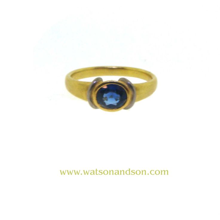 This gorgeous two-tone setting, 18k yellow gold and platinum, adds a modern flair to a traditional ring. This is an easy ring to wear because you can mix and match your yellow gold and white metal jewelry to further accessorize. Ring : 18k yellow gold and platinum ring featuring a faceted oval sapphire that is bezel set horizontally in a tapered band. Sapphire : Oval cut sapphire = 0.75 cts apx Color: Medium Blue Clarity : Eye Clean Circa : 1980  Size : 6.75  Stamped : 750  Gross Weight : 2.7 dwt Traditional Ring, Oval Sapphire Ring, Platinum Ring, White Metal, Bezel Setting, Metal Jewelry, Medium Blue, Oval Cut, Sapphire Ring