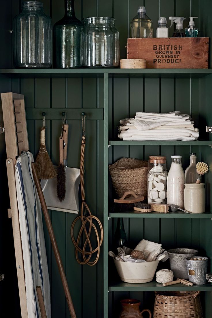 the shelves in this kitchen are filled with various items such as utensils and other household goods