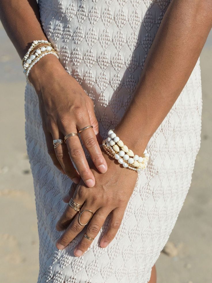 Inspired by magical Maui adventures, this beaded bracelet features beads made from a blend of white turquoise and natural pikake flowers as if plucked from lush soils of the island. ✦ DETAILS ✦✧ Name: Hakumele (HA koo MEH leh) - to weave a song; a poet.✧ Adjustable Length from: 7"-9".✧ 8mm Matte White Turquoise Beads.✧ Carved Resin Pikake Beads✧ Adjustable Length from: 14kt Gold Filled Components, Extender, and Clasp.✧ All Ke Aloha Jewelry pieces come packaged thoughtfully, beautifully, and read White Hand-strung Bracelets For Beach, White Hand-strung Beaded Bracelets For Beach, White Hand-strung Beaded Bracelet For Beach, Handmade White Pearl Bracelet For Vacation, White Beaded Pearl Bracelet For Vacation, White Hand-strung Bracelets For Vacation, Hand-strung White Bracelets For Vacation, White Hand-strung Bracelet For Vacation, Bohemian White Pearl Bracelet For Beach