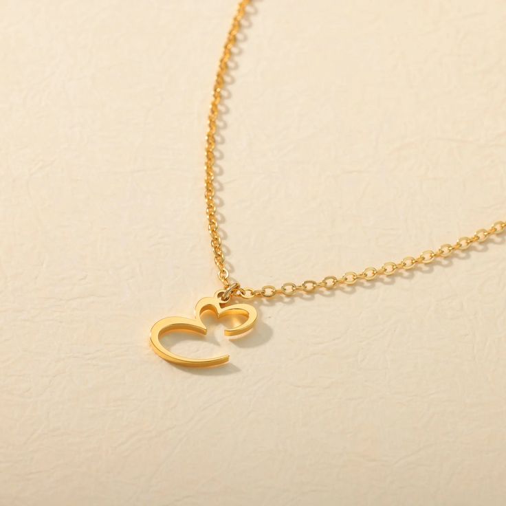 Introducing our Heart Initial Letter Necklace, a timeless and personalized piece of jewelry that beautifully captures the essence of love and individuality. This exquisite necklace features a delicate and intricately designed initial, with a charming heart delicately positioned beside it.Whether it's a gift for yourself or a loved one, the Heart Initial Letter Necklace is a cherished keepsake that symbolizes the profound connections we share with others. Wear your own initial or that of a specia Elegant Name Necklace For Valentine's Day Gift, Elegant Personalized Heart Pendant Charm Necklace, Elegant Heart Pendant Charm Necklace For Personalized Gift, Elegant Heart-shaped Name Necklace As Gift For Her, Elegant Heart-shaped Name Necklace For Her, Elegant Charm Necklaces For Valentine's Day Personalized Gift, Elegant Personalized Charm Necklace For Valentine's Day, Elegant Heart Necklace For Valentine's Day Personalized Gift, Elegant Charm Necklace For Valentine's Day Personalized Gift