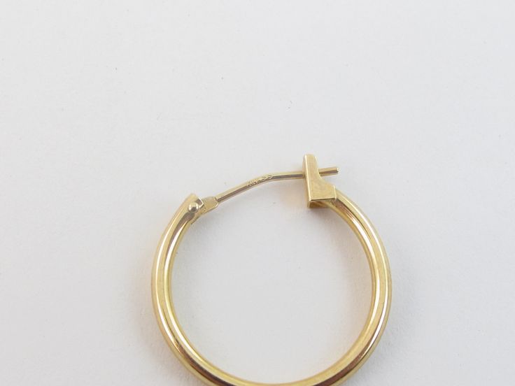 "Offering here is a pair of fabulous 14k yellow gold hoop earrings!! Purity : 14k yellow gold, Tested and stamped Measurements : 5/8\" in diameter or 17 mm wide by 1.5 mm thick. Closure: Hinged post and omega catch. Weight: 0.6 gram Complementary Gift Box These earrings are about the same size as a dime. Images may be enlarges to show details.Please pay attention to the photos and read description before the purchase. I ask you earnestly to make sure about measurements such as size , thickness, Formal 14k Stamped Hoop Huggie Earrings, Oval Yellow Gold Hoop Earrings Stamped 14k, Oval 14k Stamped Yellow Gold Hoop Earrings, Classic Yellow Gold Hoop Earrings Stamped 14k, Yellow Gold Hinged Hoop Earrings For Everyday, Everyday Yellow Gold Hinged Hoop Earrings, Anniversary Yellow Gold Hinged Hoop Earrings, Yellow Gold Hallmarked Hoop Earrings For Everyday, Yellow Gold 14k Huggie Hoop Earrings