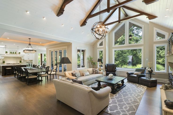 a living room filled with furniture and windows