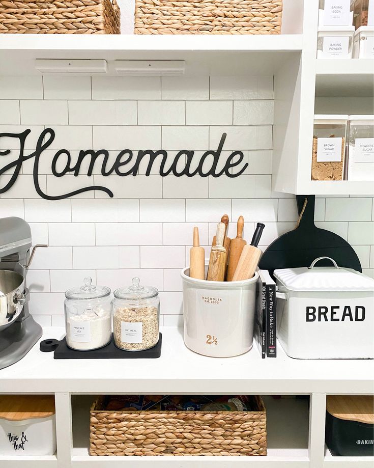 the shelves in this kitchen are filled with bread and other cooking utensil items