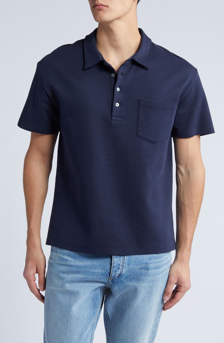 Classic and comfortable, this polo crafted from breathable cotton features a simple patch pocket and a relaxed feel that's perfect for any casual look. 27" length (size Medium) Button half-placket Spread collar Short sleeves Chest patch pocket 100% cotton Machine wash, tumble dry Imported Blue Cotton Polo Shirt With Placket, Classic Blue Polo Shirt With Pockets, Navy Cotton Polo Shirt For Work, Navy Polo Shirt With Button Closure For Work, Classic Navy Cotton Polo Shirt, Navy Cotton Polo Shirt With Button Closure, Navy Polo Collar Top With Pockets, Navy Casual Polo Shirt Relaxed Fit, Casual Navy Relaxed Fit Polo Shirt