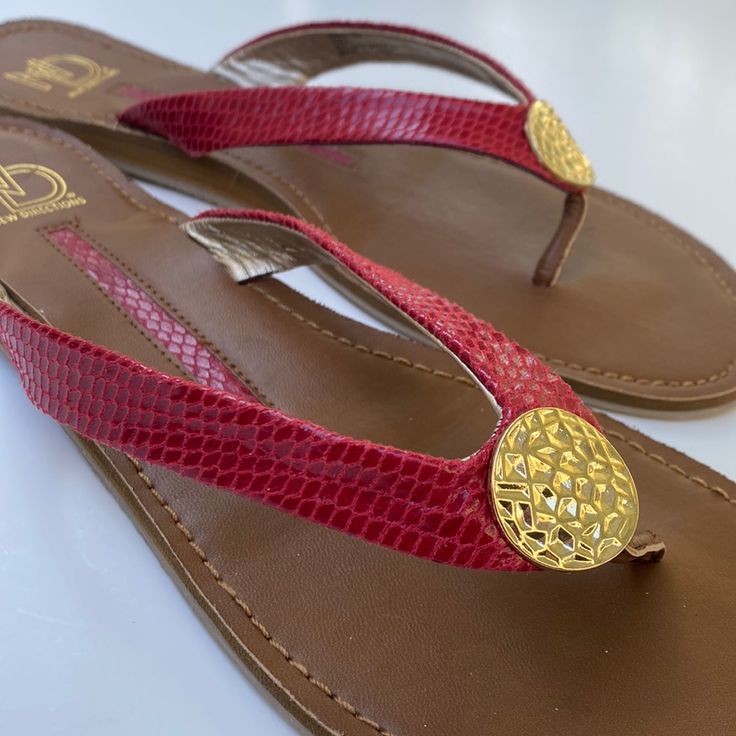 New! Size 10 Cute Nd New Directions Flip Flops Deep Red Thong Flat Sandals In Snakeskin Pattern With Round Gold Color Emblem Medallion Accent. In New Condition With Original Sticker Tag. No Box. Some Slight Material Lift During Shelf Life So Priced Accordingly. Please View Pics Carefully For Condition, Material & Measurements. (Feel Free To Comment Below If Additional Info Is Needed). Please Browse My Closet To Bundle & Save! Thanks For Visiting “In The Past Lane”. Casual Red Toe Post Flip Flops, Adjustable Red Flip Flops For Beach, Red Adjustable Sandals With Single Toe Strap, Red Adjustable Toe Post Sandals, Red Toe Post Flip Flops For Vacation, Red T-strap Sandals For The Beach, Adjustable Red Open Toe Flip Flops, Red Leather Flip Flops For Vacation, Red Adjustable Synthetic Sandals