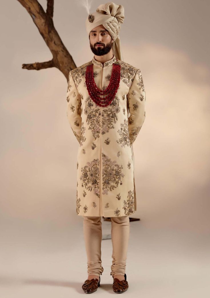 Editor's Note Featuring our work of art in our golden placement hand-embroidered sherwani with an intricate embroidery technique using different types of dabka and moti. Paired with a wine hand-embroidered stole and matching safa. Fabric: Linen silk Color: Golden Components: Sherwani, kurta, churidar, stole and safa Occasion: Groom Fit: Regular Note: Product colour may slightly vary due to photographic lighting sources Care: Dry clean only About the Designer After establishing himself as the lea Jatin Malik, Embroidered Sherwani, Blouse Yoke, Dhoti Pants, Haldi Ceremony, Royal Look, Indian Man, Indian Wedding Outfits, Intricate Embroidery