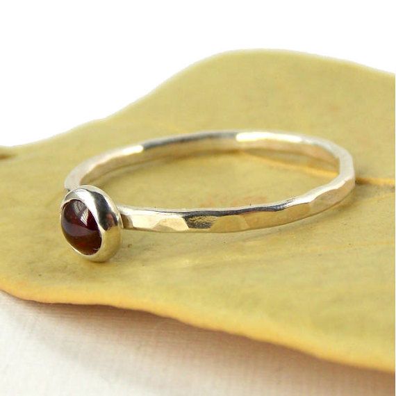 Garnet Hammered Band Stacking Ring - 925 sterling silver ring with 4mm red garnet cabochon - Stackab Red Garnet Round Band Jewelry, Garnet Birthstone Jewelry In Round Shape, Round Garnet Birthstone Jewelry, Red Garnet Stackable Jewelry, Round Garnet Jewelry With Polished Finish, Garnet Birthstone Jewelry With Round Band, Garnet Ruby Ring As Birthstone Gift, Ruby Ring As Birthstone Gift, Round Burgundy Garnet Jewelry