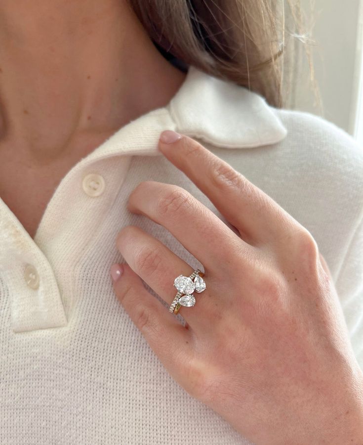 a close up of a person wearing a ring