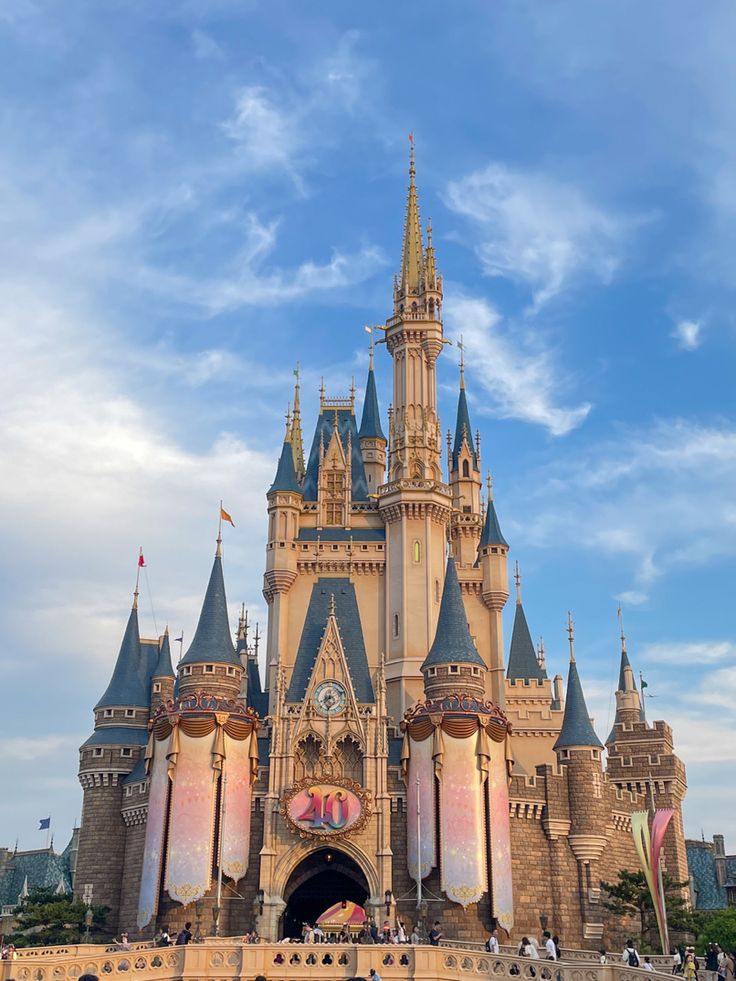 a castle with people standing in front of it