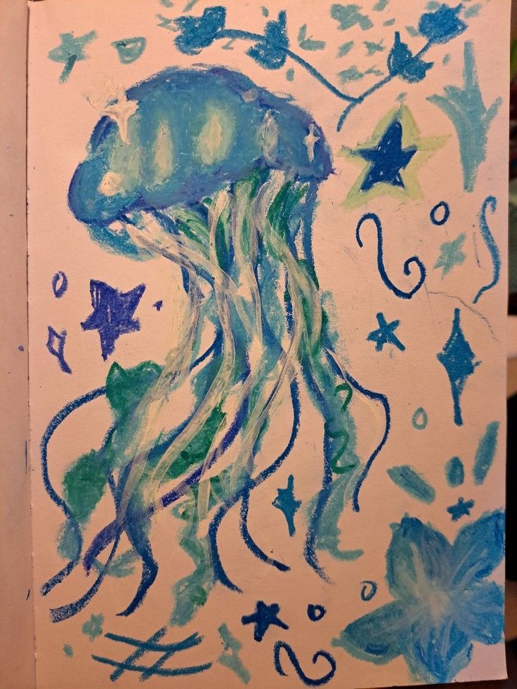 a drawing of a jellyfish in blue and green watercolors on white paper